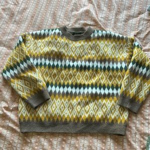 Yellow, green, white, and brown patterned sweater. Size medium